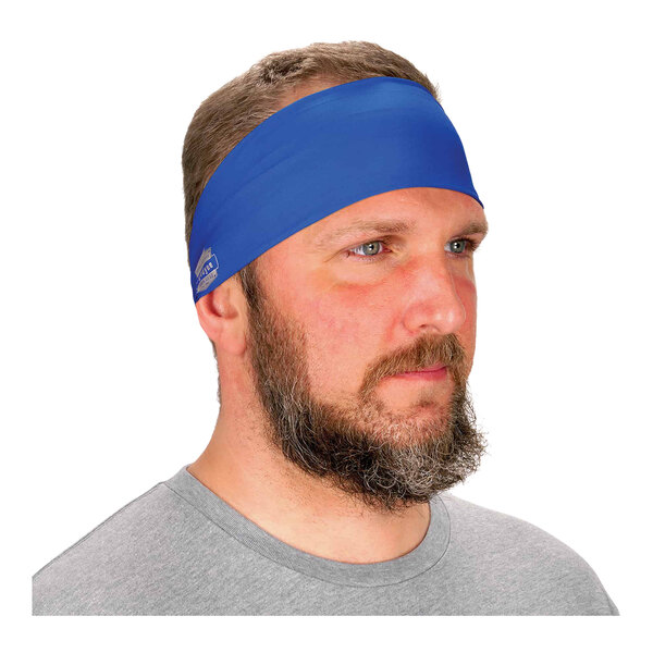 A man wearing a blue Ergodyne Chill-Its evaporative cooling headband.