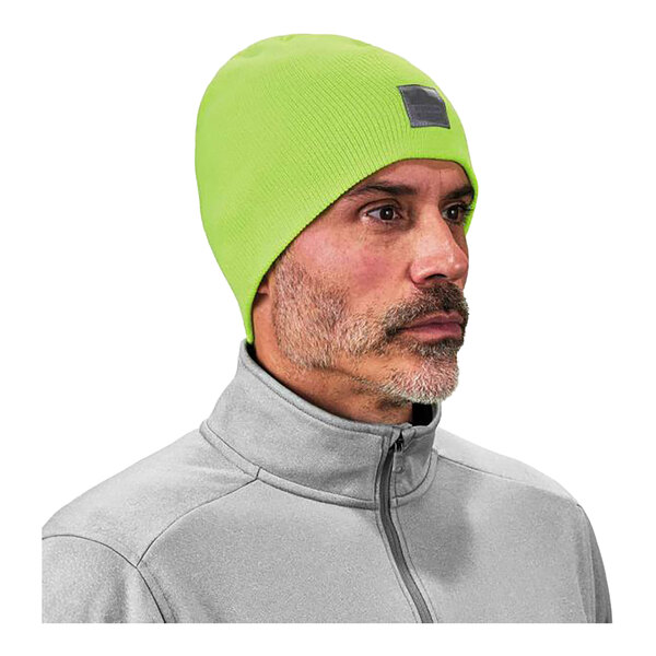 A man wearing a Hi-Vis lime green rib knit winter hat.