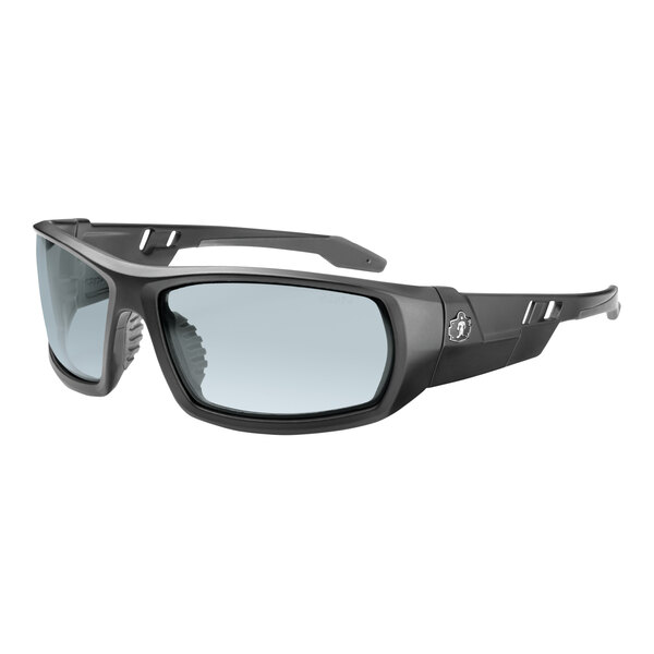 A close-up of Ergodyne Skullerz ODIN safety glasses with a matte black frame and gray lenses.