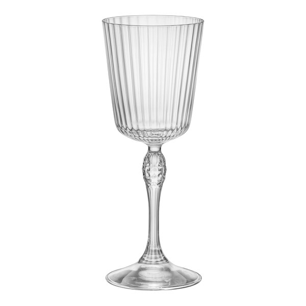 A close-up of a Bormioli Rocco America cocktail glass with a stem and a ribbed rim.