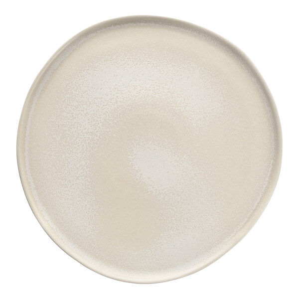A white Cloud Terre by Fortessa dinner plate with a spiral pattern on the rim.