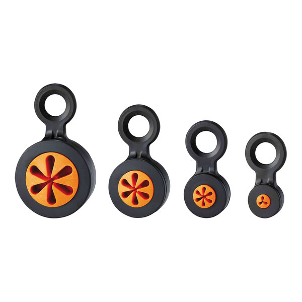 A group of black and orange circular plastic objects with a hole in the center.