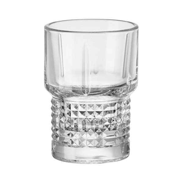 A close-up of a clear Bormioli Rocco shot glass with a diamond cut design.