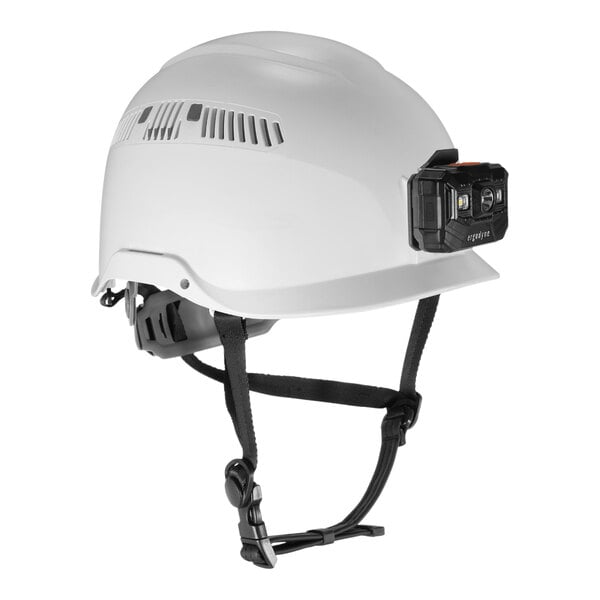 A white Ergodyne Skullerz safety helmet with a LED light attached to the front.
