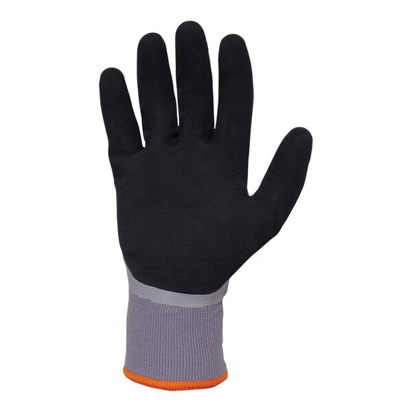 A close-up of an Ergodyne ProFlex medium freezer glove with a sandy nitrile palm and orange trim.