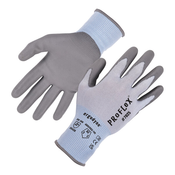 A pair of blue and gray Ergodyne ProFlex work gloves with text on the wrist.