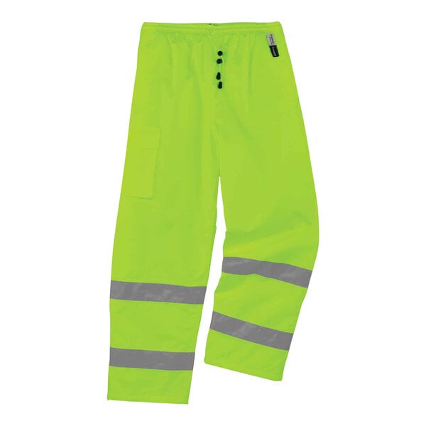 A pair of bright green Ergodyne thermal pants with reflective stripes.