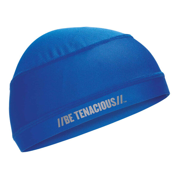 A blue Ergodyne knit skull cap with white text that reads "Tenacious"