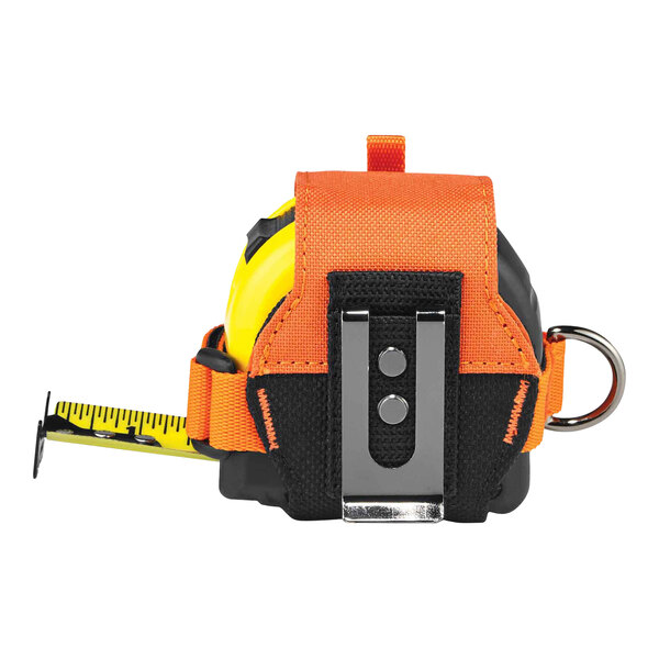 An Ergodyne orange tape measure holder with a belt clip and strap holding a tape measure.
