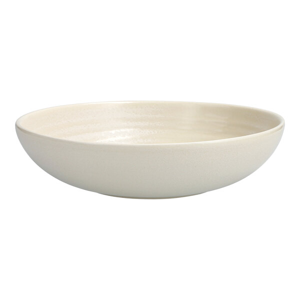 A white Cloud Terre by Fortessa pasta bowl with a textured surface and a small rim.