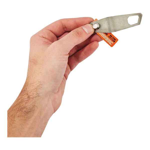 A hand using an Ergodyne Squids tool tether to hold a small metal tool.