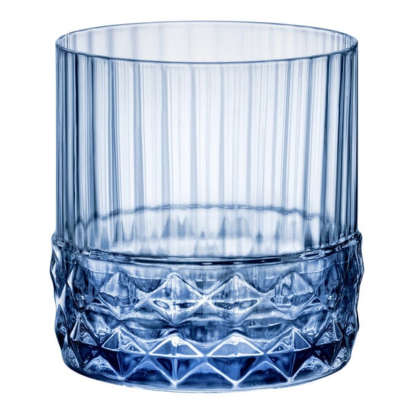 A close up of a Bormioli Rocco blue glass with a diamond pattern.