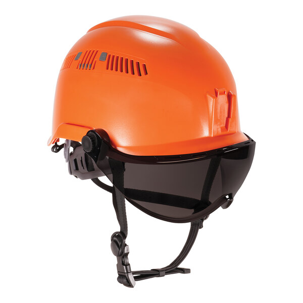 An orange Ergodyne Skullerz safety helmet with black straps and a smoke visor.