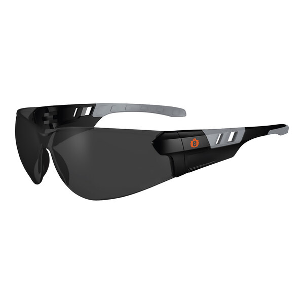 A pair of black Ergodyne Skullerz safety glasses with grey lenses.