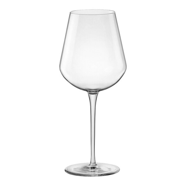 A clear wine glass with a long stem.