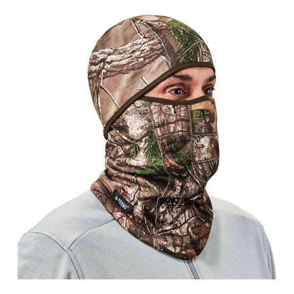 A man wearing an Ergodyne RealTree Edge camouflage fleece balaclava face mask.
