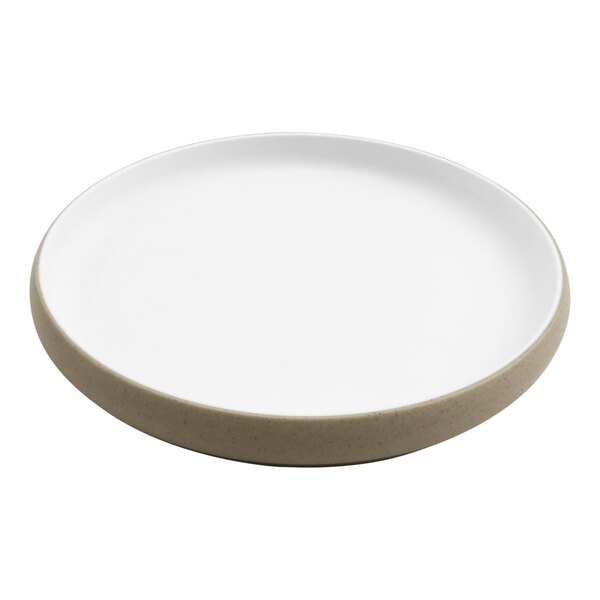 A white cheforward melamine plate with a tan rim.