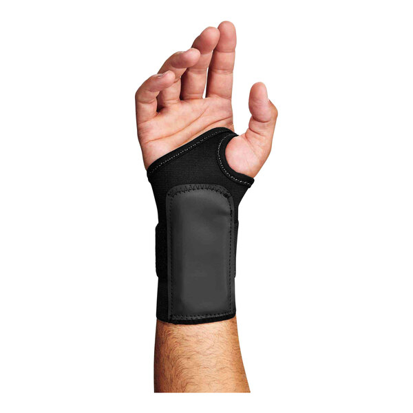 A person holding an Ergodyne ProFlex black wrist support with a black strap.