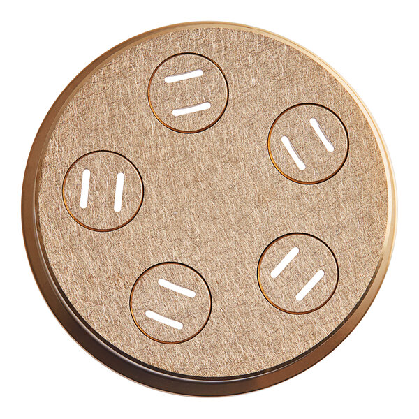 A round metal pasta die with four holes in it.
