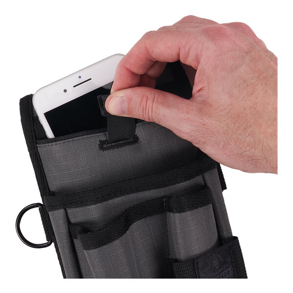 A hand pulling a cell phone out of a black pouch attached to a belt.