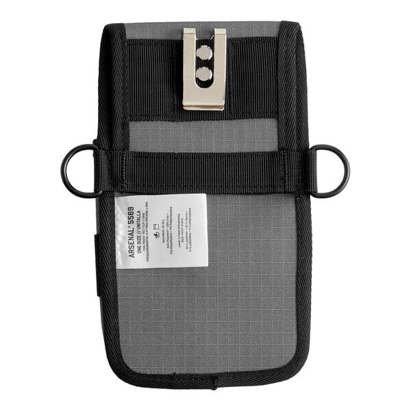 A rectangular black and gray fabric pouch with a metal belt clip, two side rings, and a visible white label.