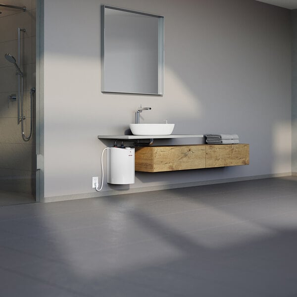 A compact white electric mini tank water heater installed under a modern bathroom sink.
