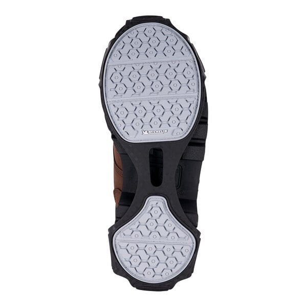 The black and white sole of an Ergodyne TREX slip-resistant traction device.