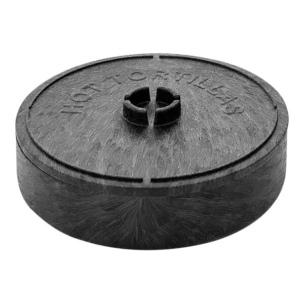 A black circular HS Inc. tortilla server with a hole in it.