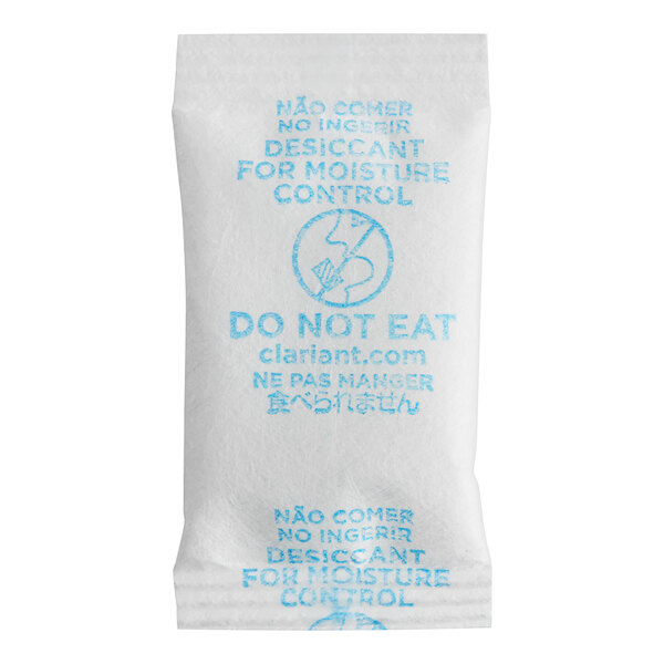 A close-up of a Clariant Sorb-It 3 gram desiccant silica packet with blue text on a white surface.