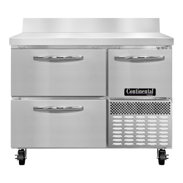 A Continental Refrigerator stainless steel worktop freezer with 2 drawers and a half door.