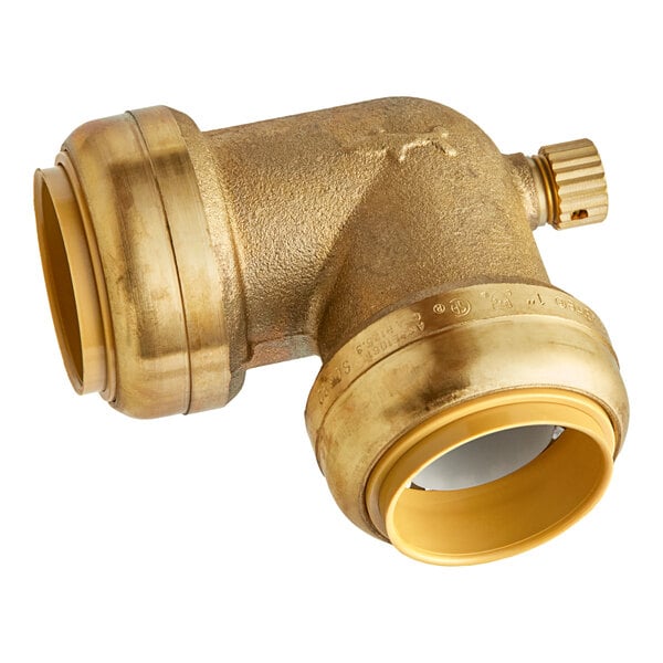 A SharkBite brass 90 degree elbow with two brass push-to-connect ends and a drain cap.