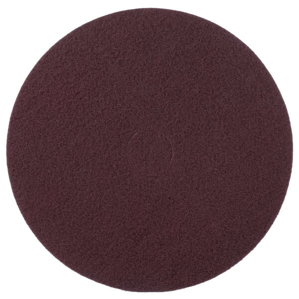 A maroon circular Scrubble floor pad with a thin brown line.