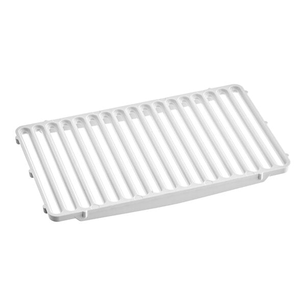 A white plastic grate with holes for a Grindmaster Cecilware refrigerated beverage dispenser.