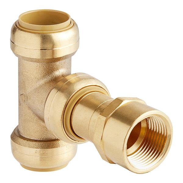 A gold brass SharkBite pipe fitting with a nut.