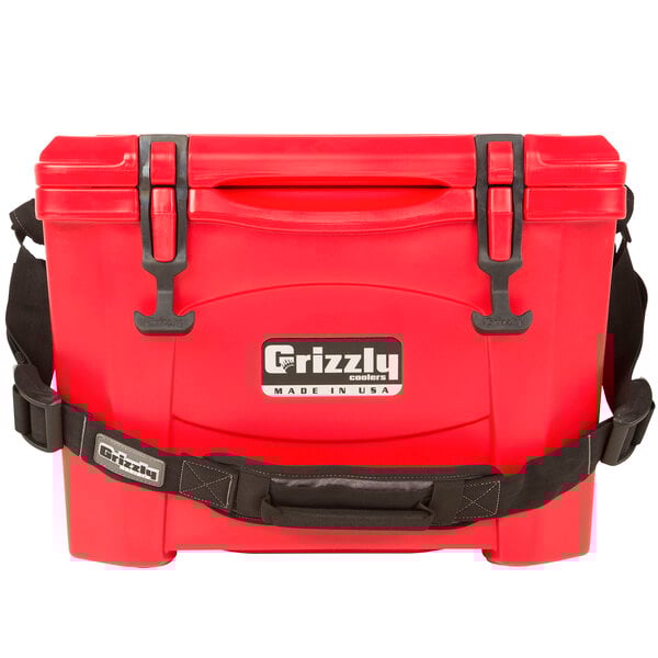 A red Grizzly Cooler with black handles.
