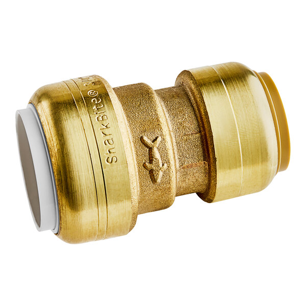 A SharkBite brass pipe fitting with a white inner tube.