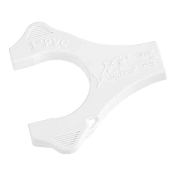 A white SharkBite PVC disconnect clip with text on it.