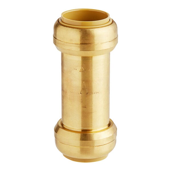 A close-up of a gold cylinder with a hole in it.
