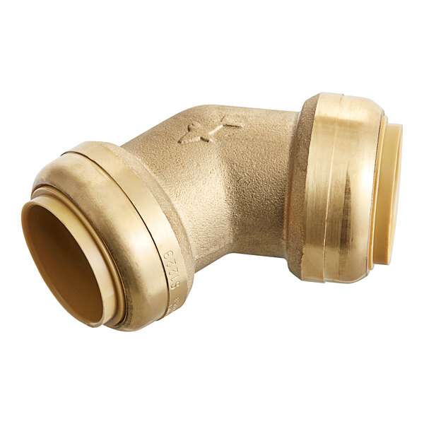 A close-up of a gold SharkBite 45 degree elbow pipe fitting.