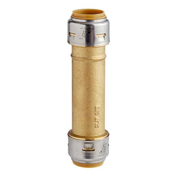 A gold and silver cylindrical brass SharkBite slip coupling with a yellow label.