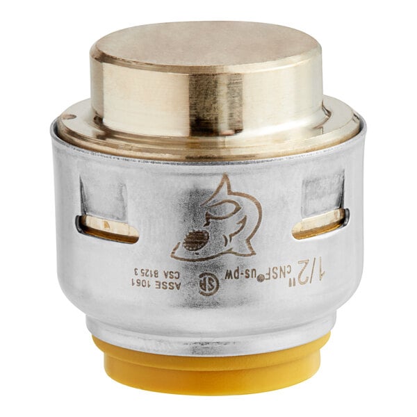 A close up of a SharkBite brass and yellow metal end cap.