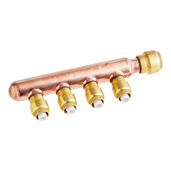 A copper pipe with white and gold SharkBite brass fittings.