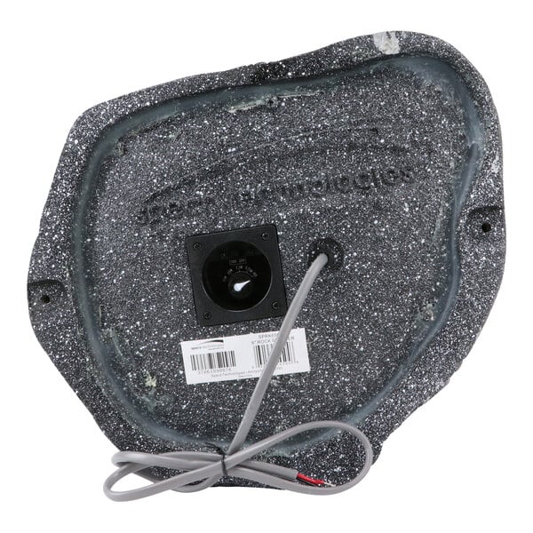A black and grey granite outdoor rock speaker with a wire.