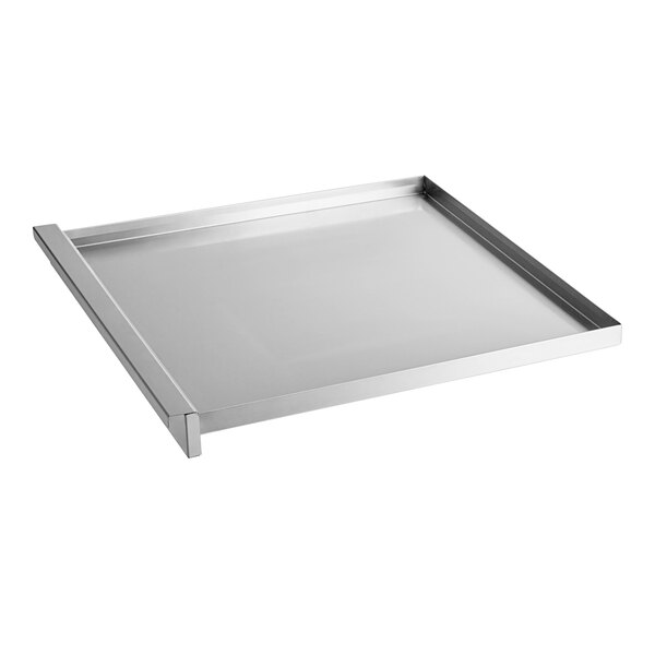A stainless steel Cooking Performance Group fat tray with a handle.