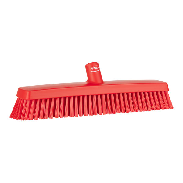 A red Vikan heavy-duty broom head with soft/stiff bristles.