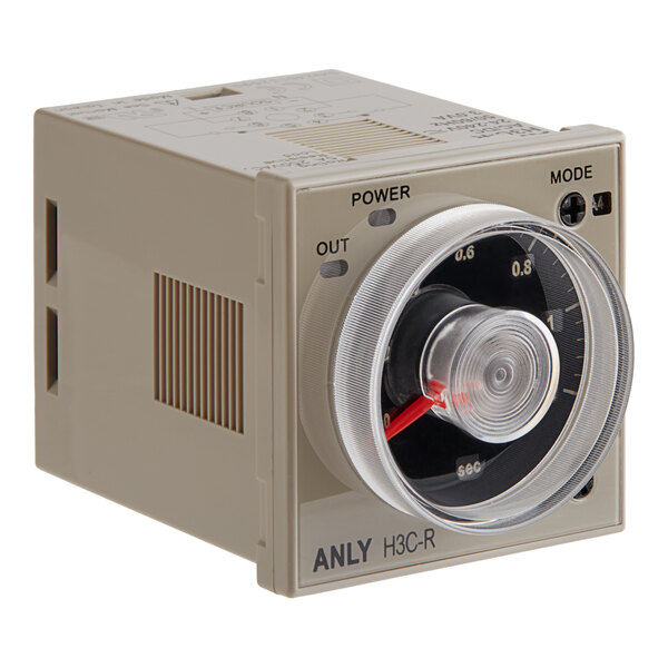 A white box with a round dial for a Cooking Performance Group rotisserie oven timer.