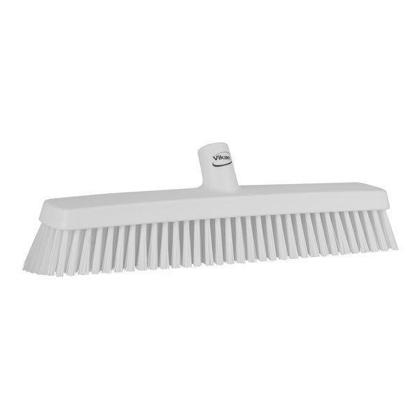 A white Vikan heavy-duty push broom head with soft/stiff bristles.