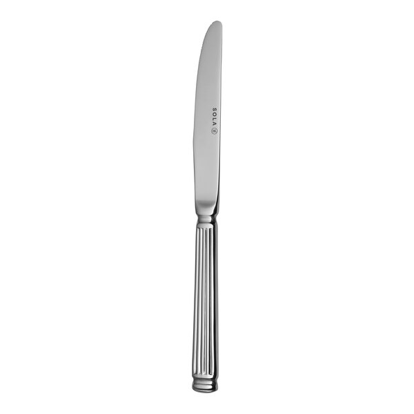 A Sola stainless steel dinner knife with a handle.