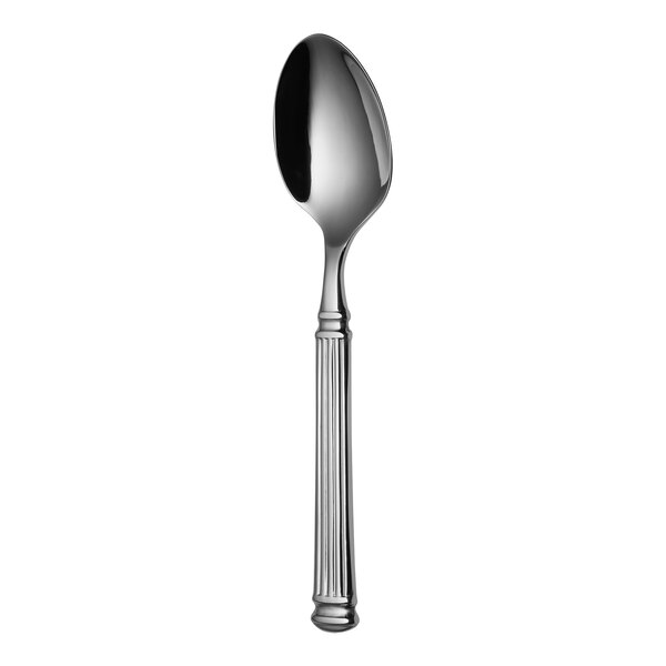 A Sola stainless steel serving spoon with a faceted handle.