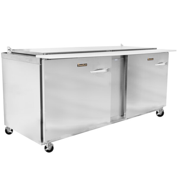 A Traulsen stainless steel refrigerator with two left hinged doors.